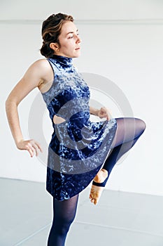 Young female performer practicing contemporary dance elements