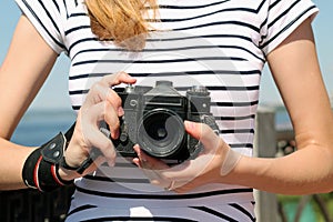 Young female photographer with a camera