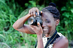 Young female photographer taking pictures.