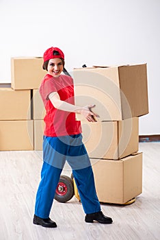 Young female professional mover doing home relocation