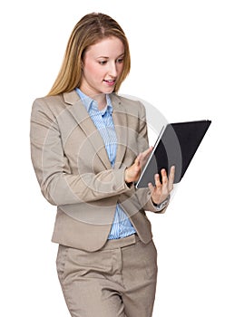 Young female professional operating her tablet pc