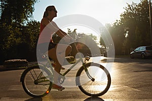 Young Female Riding Bike photo