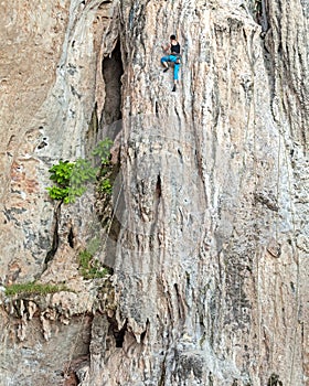 Young female rock climber.