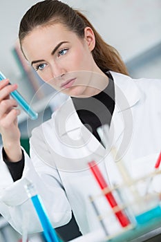 Young female scientist loads samples for dna