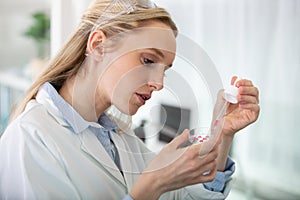 young female scientist loads samples for dna amplification