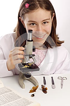 Young female scientist with microscope