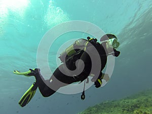 Young female scuba diver in Atlantic ocean