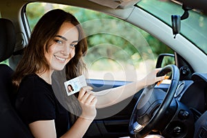 Young female shows drivers license