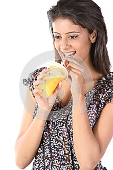 Young female sipping orange juice