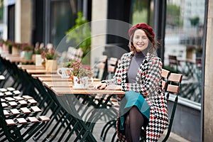 Young female sitting at cafe on the street of Budapest