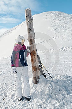 Young female skier admiring the stunning view