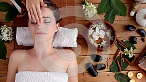 Young female at spa salon. Ayurveda massage