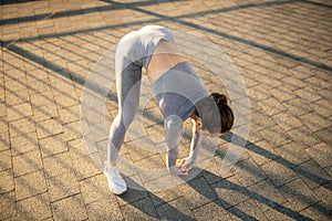 Young female sportsperson doing sports outside photo