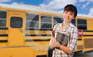 Young Female Student Near School Bus