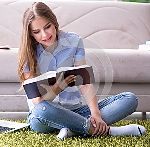 Young female student preparing for college exams