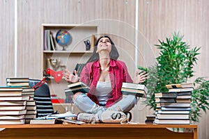 The young female student preparing for college school exams