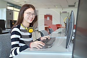 Young female student study in the school library, She using laptop and learning online, Back to school education knowledge college