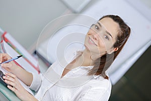 Young female student at university classroom