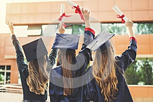 Young female students graduating from university
