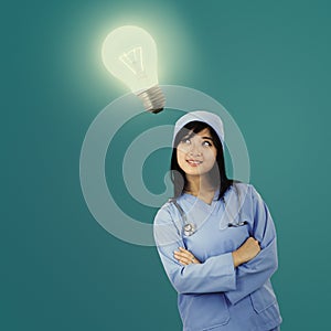 Young female surgeon with light bulb