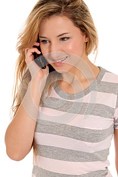 Young female talking by telephone and smiling