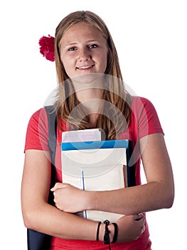 Young female teenage student carrying books