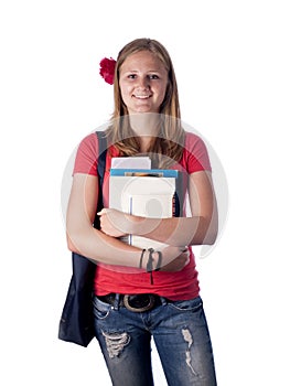 Young female teenage student carrying books