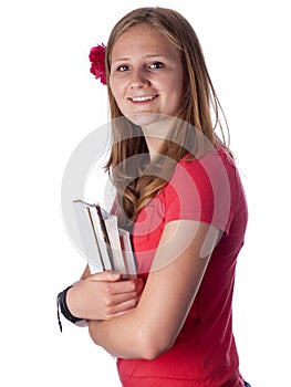 Young female teenage student carrying books