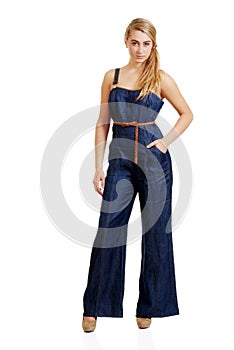 Young female teenager in jeans jumpsuit