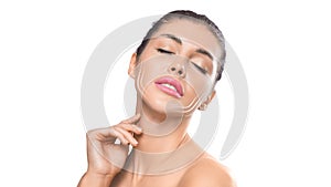 Young female touchin her clean fresh skin over white background.