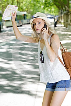 young female tourist hailing cab