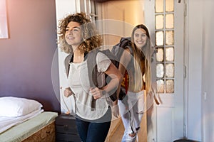 Young female tourists staying in youth hostel photo