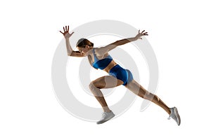 Young female track athlete training isolated over white studio background.