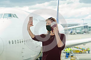 young female traveler, Blogger in airport lounge near windows happy smile taking selfie photo flight