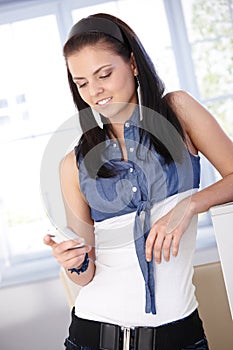 Young female using mobile phone