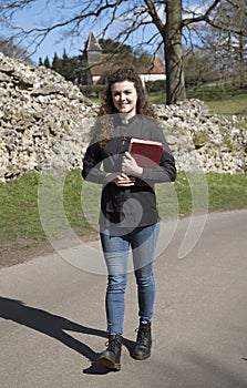 Young female vicar walking in her parish