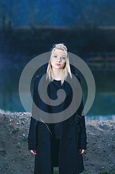 Young female wearing black hood