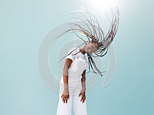 Young female in white casuals with long braids