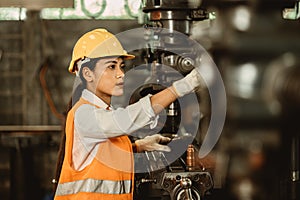 Young female women attend worker happy working in metal factory workplace work engineer fix maintenance heavy industry machine