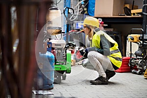 Young female worker in a warehouse.