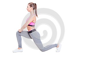 Young female working out standing in lunge position