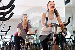 Young females of different age training on exercise bikes