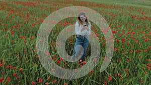Young feminine blogger woman in flower field