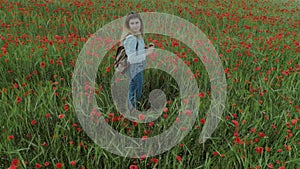 Young feminine blogger woman in flower field