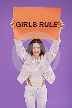 Young feminist girl with poster