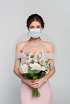 young fiancee in medical mask holding