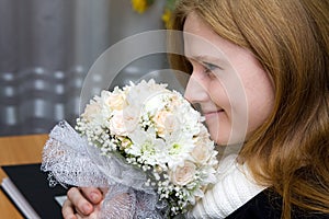 A young fiancee with a wedding bouquet