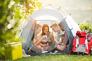 Young fiends have fun in tent