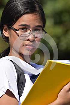 A Young Filipina Female Student Reading