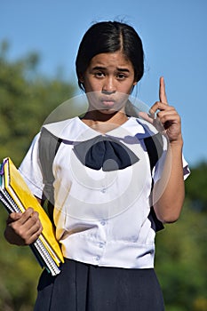 Young Filipina Girl Student Having An Idea Wearing School Uniform